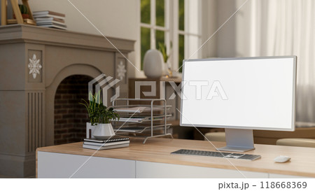A close-up of a computer on a minimal wooden desk in a luxurious Scandinavian living room. 118668369