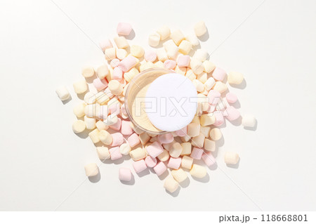 Face powder with marshmallows on a light background. Face powder with marshmallows on a light background. 118668801