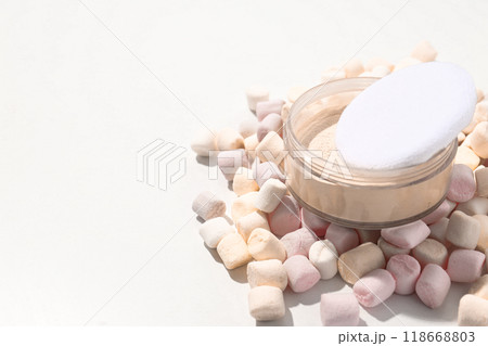 Face powder with marshmallows on a light background. Face powder with marshmallows on a light background. 118668803
