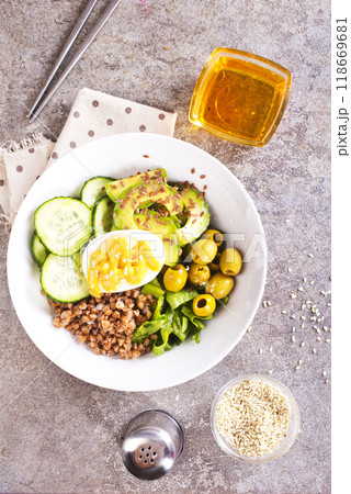 backwheat and vegetables on white plate 118669681