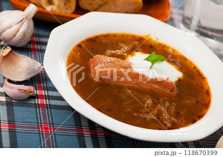 Shchi in mushroom broth with pork and sour cream 118670399