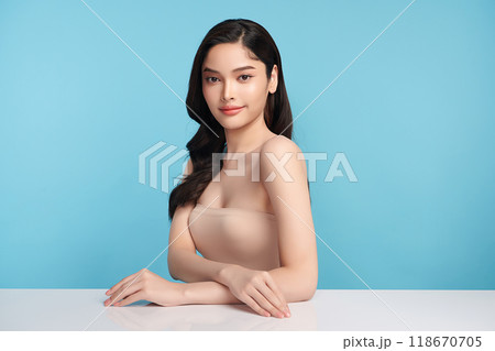 Beautiful young asian woman with clean fresh skin on blue background, Face care, Facial treatment, Cosmetology, beauty and spa, Asian women portrait. 118670705