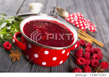 raspberry jam in red metal bowl 118671283