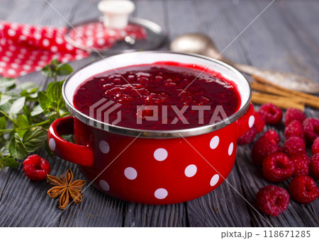 raspberry jam in red metal bowl 118671285