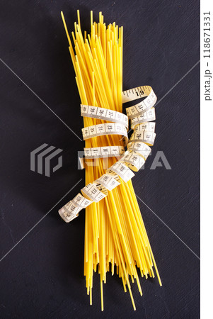 string spaghetti on black background 118671331
