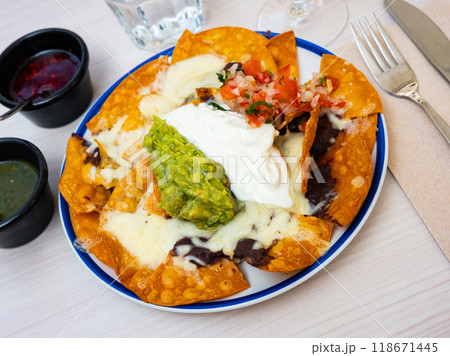 Mexican Nachos from fried totopos with sauces Mexican Nachos from fried totopos with sauces 118671445