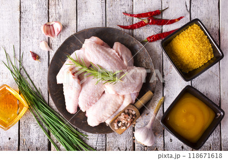 Raw chicken wings, herbs and spices with pepper chili tomato garlic for cooking thai asian food rosemary chicken, top view. 118671618
