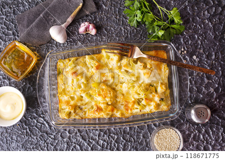 Cauliflower cheese in a baking dish on stone table 118671775