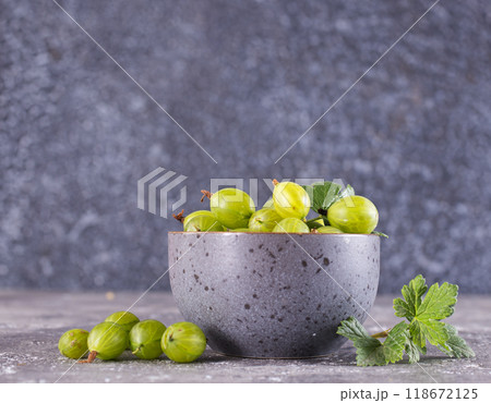 Fresh gooseberry in gray bowl on a table Fresh gooseberry in gray bowl on a table 118672125