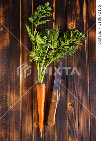 Orange and yellow carrots on a table Orange and yellow carrots on a table 118672155