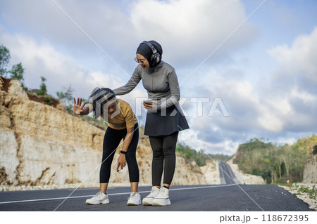 moslem woman supporting friend giving up exercise 118672395