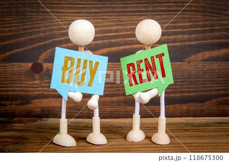 Buy or Rent. Two speech bubbles and miniature people on a wooden texture background Buy or Rent. Two speech bubbles and miniature people on a wooden texture background 118675300