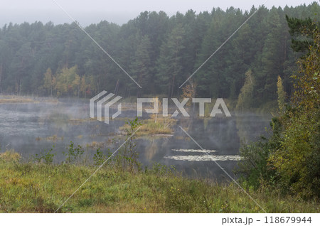 Foggy morning on a lake in autumn. Nature of Eastern Siberia 118679944