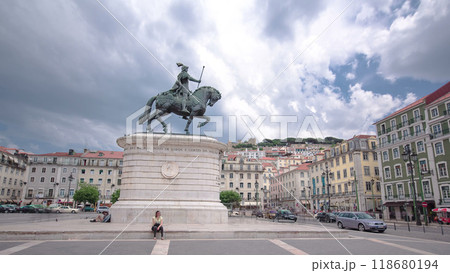 Figueira Square in the Baixa district. King Dom Joao I statue and Sao Jorge Castle on top of hill timelapse hyperlapse 118680194