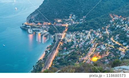 Day to night timelapse view of the Mediterranean coastline of the town of Eze village on the French Riviera 118680373