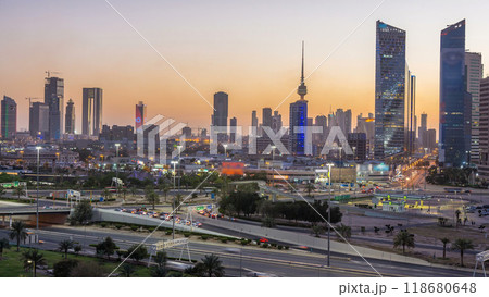 Skyline with Skyscrapers day to night timelapse in Kuwait City downtown illuminated at dusk. Kuwait City, Middle East 118680648
