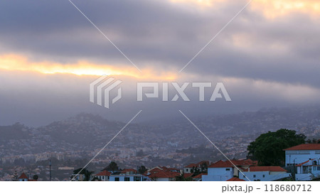 Sunset over houses from hill in Funchal, Madeira, Portugal timelapse 118680712