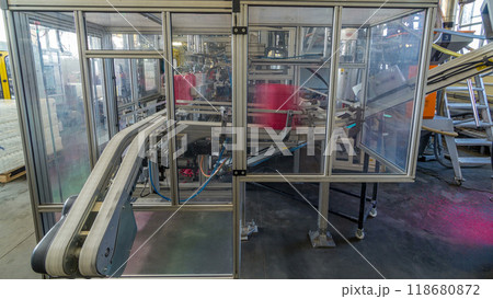 A factory for plastic canister production timelapse hyperlapse. The conveyor in the factory. 118680872