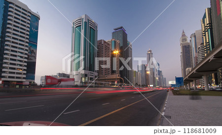 Skyscrapers at the Sheikh Zayed Road day to night in Dubai timelapse hyperlapse 118681009