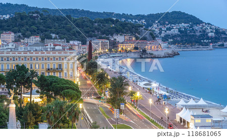 Evening aerial panorama of Nice day to night timelapse, France. Lighted Old Town little streets and waterfront after sunset Evening aerial panorama of Nice day to night timelapse, France. Lighted Old Town little streets and waterfront after sunset 118681065
