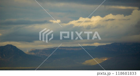 wind turbines and the sea of clouds on stretches of blue mountains backgrounda panoramic view 118681833