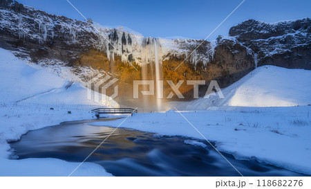 Seljalandsfoss waterfall, Iceland. Icelandic winter landscape. High waterfall and rocks. Seljalandsfoss waterfall, Iceland. Icelandic winter landscape. High waterfall and rocks. 118682276