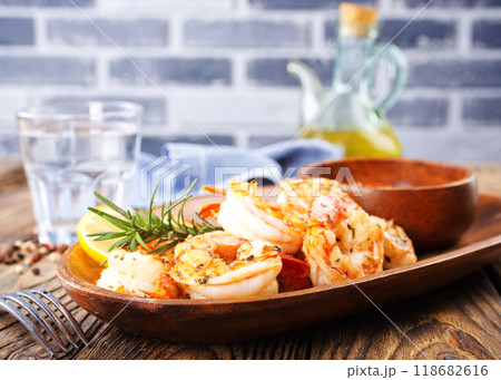 Fried shrimps with garlic, lime and fresh rosemary Fried shrimps with garlic, lime and fresh rosemary 118682616