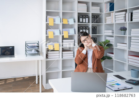 businesswoman plans a finance audit, reviewing documents while battling burnout syndrome. businesswoman plans a finance audit, reviewing documents while battling burnout syndrome. 118682763