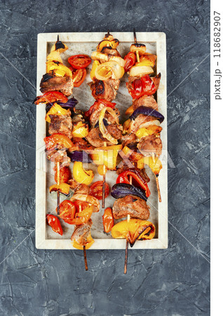 Barbecued meat with garnish. 118682907