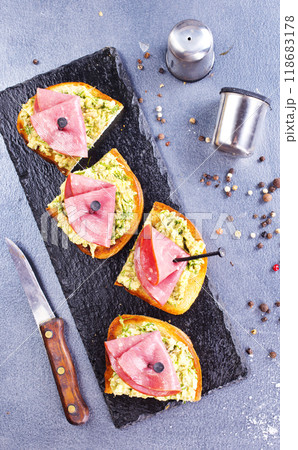 Rye bread sandwich with sliced Italian ham and a creamy homemade avocado cashew spread. Rye bread sandwich with sliced Italian ham and a creamy homemade avocado cashew spread. 118683178