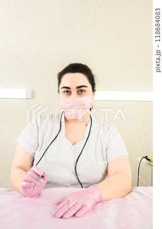 Electrologist is waiting patient for remove hair by method electroepilation. 118684083