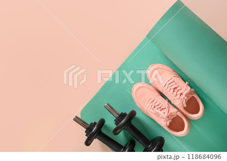 Banner of fitness equipment, dumbbells, pink shoes. Top view. Copy space. 118684096