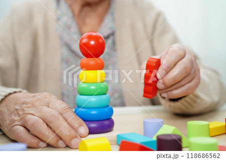 Asian elderly woman playing game. 118686562