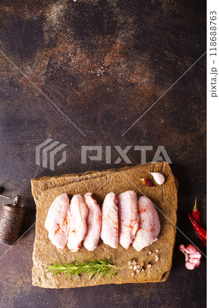 Raw chicken wings with ingredients for cooking Raw chicken wings with ingredients for cooking 118688763