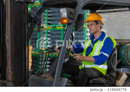 Man wear safety helmet driver forklift warehouse in factory. Male worker industrial operate. Man wear safety helmet driver forklift warehouse in factory. Male worker industrial operate. 118688776