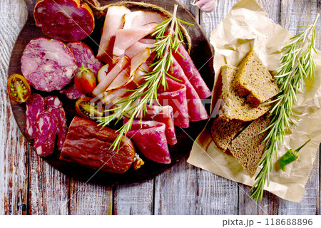 Slices of delicious spanish sausage salam, smoked meat, sausages. 118688896