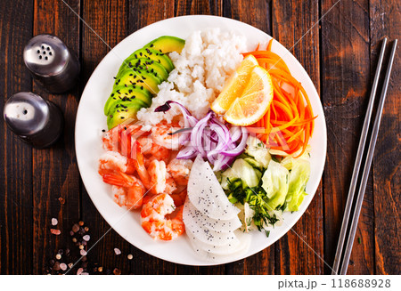 Poke bowl and ingredients on wooden table, 118688928