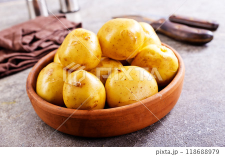 bowl with raw potatoes on a table bowl with raw potatoes on a table 118688979