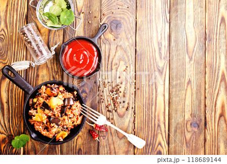 fried rice with vegetables, rice with eggplant and onion 118689144