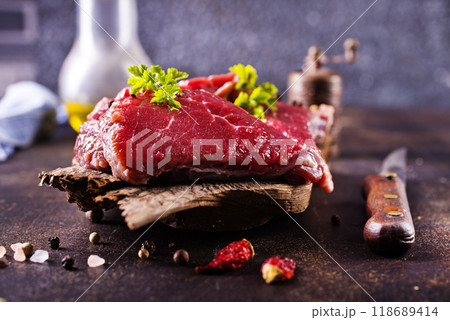 Raw meat with herbs and garlic, marble meat. Wooden background. Top view. 118689414