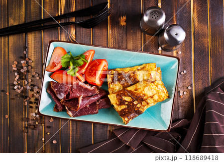 Omelette rolls with ham and cheese. Healthy breakfast. 118689418
