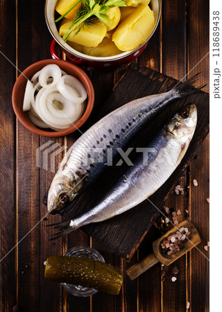 Herring or Baltic herring on wooden table Herring or Baltic herring on wooden table 118689438