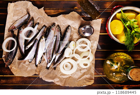Salted Baltic fish with potato and onion 118689445