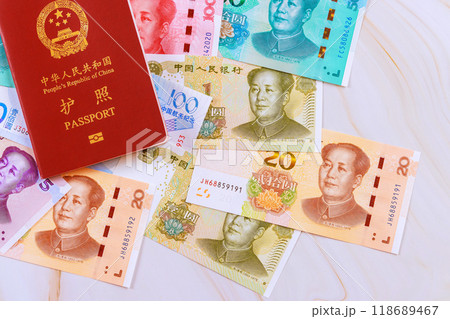People Republic of China passport with Chinese yuan currency in various denominations People Republic of China passport with Chinese yuan currency in various denominations 118689467