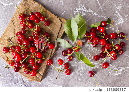 Sweet cherry on stone tray on a table Sweet cherry on stone tray on a table 118689517