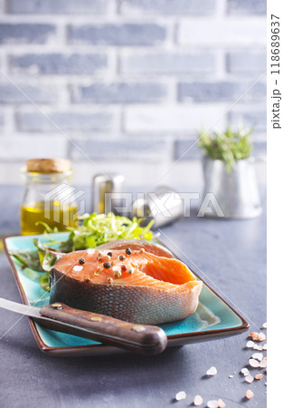 Fresh raw salmon steak with spices. Healthy seafood food Fresh raw salmon steak with spices. Healthy seafood food 118689637