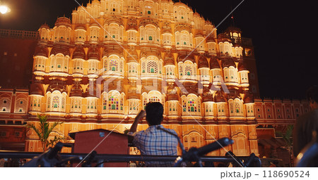 Jaipur, Rajasthan, India. Hawa Mahal Palace In Night Illuminations. Tourist Takes Photo Of Palace. Palace Of Winds. Built From Red And Pink Sandstone. Maharaja Sawai Pratap Singh Built Palace In 1799 118690524