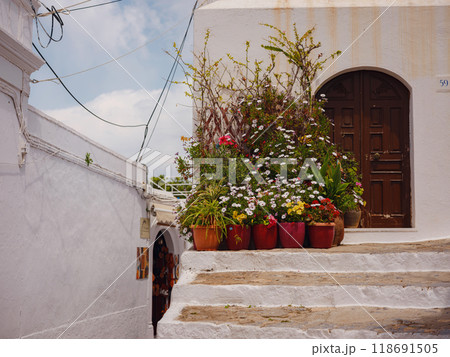 travel to city of Lindos on island of Rhodes, Greece. Details of streets of old town Lindos. Interesting elements of door, shutters, bas-relief of walls. tourist attraction on island of Rhodes 118691505