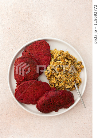 Beet pancakes with sunflower seed hummus - a healthy, vegetarian, and delicious dish combining nutritious 118692772