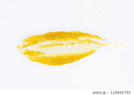Smear of mustard sauce on white background isolate, creativity in cooking, macro texture Smear of mustard sauce on white background isolate, creativity in cooking, macro texture 118692793